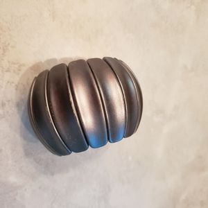 Beautiful, big, gun metal elastic bracelet. Very light and fun.